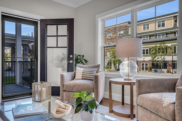 living area featuring wood finished floors and baseboards