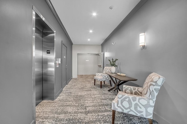 hall with elevator and baseboards