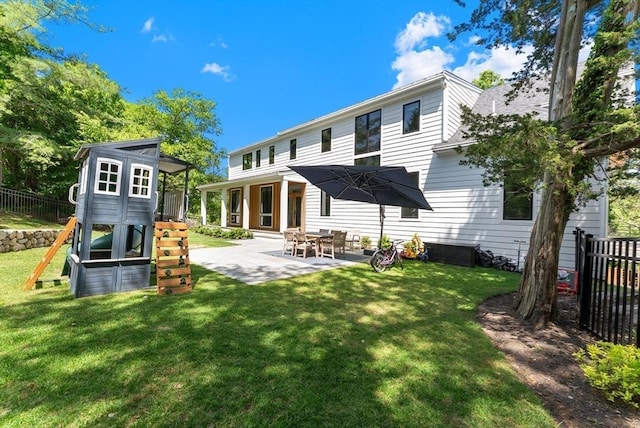 135 Beach St, Cohasset, MA 02025 - rear view of house featuring a playground and a patio