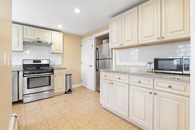 11-13 Turner Ter, Newton, MA 02460 - kitchen featuring appliances with stainless steel finishes, under cabinet range hood, a baseboard heating unit, decorative backsplash, and recessed lighting