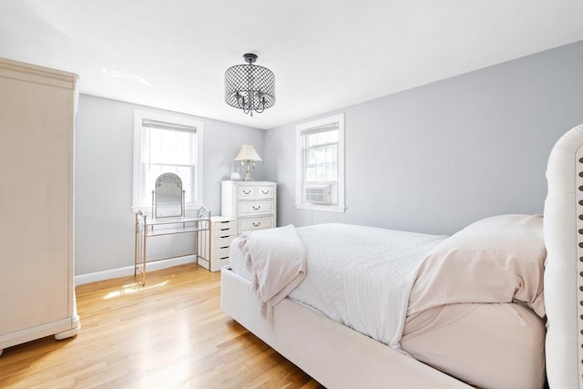 11-13 Turner Ter, Newton, MA 02460 - bedroom featuring light wood-type flooring, multiple windows, and cooling unit
