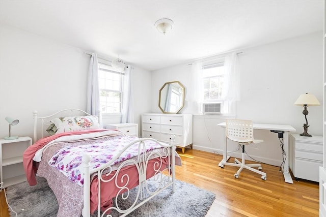 11-13 Turner Ter, Newton, MA 02460 - bedroom featuring multiple windows and wood finished floors