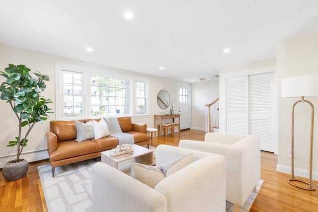 11-13 Turner Ter, Newton, MA 02460 - living area with recessed lighting, light wood-style floors, and a baseboard heating unit