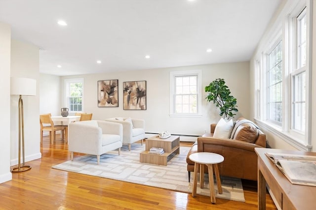 11-13 Turner Ter, Newton, MA 02460 - living area with light wood-style floors, recessed lighting, a baseboard radiator, and baseboard heating