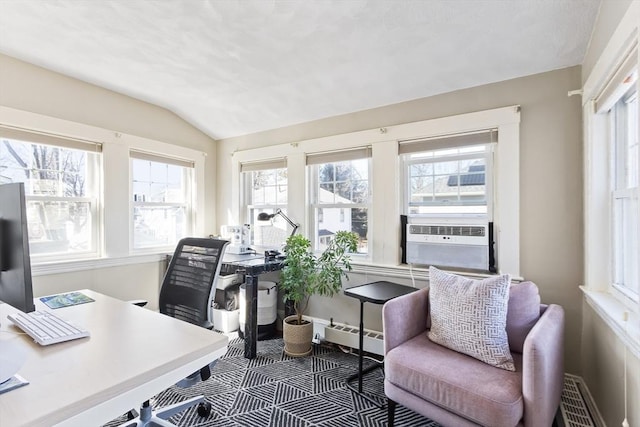 home office with baseboards, vaulted ceiling, and cooling unit