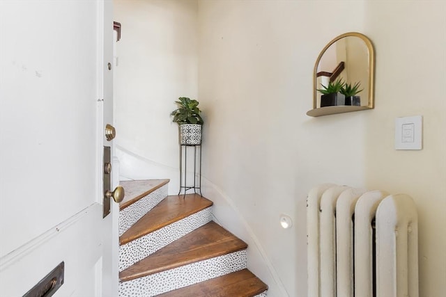 staircase featuring radiator