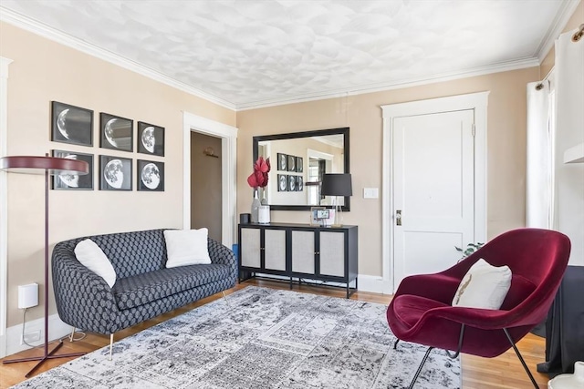 living room featuring baseboards, ornamental molding, and wood finished floors