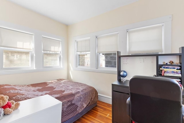 bedroom featuring wood finished floors