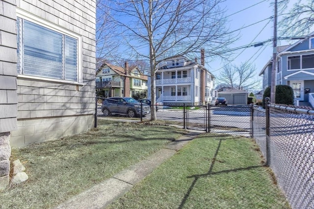 view of yard with fence and a gate