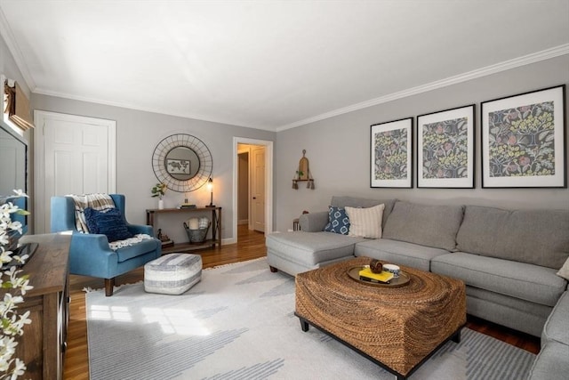 living room with ornamental molding and wood finished floors