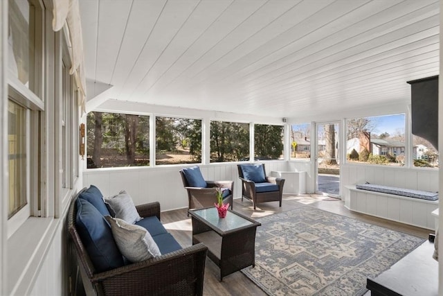 sunroom with plenty of natural light and wooden ceiling