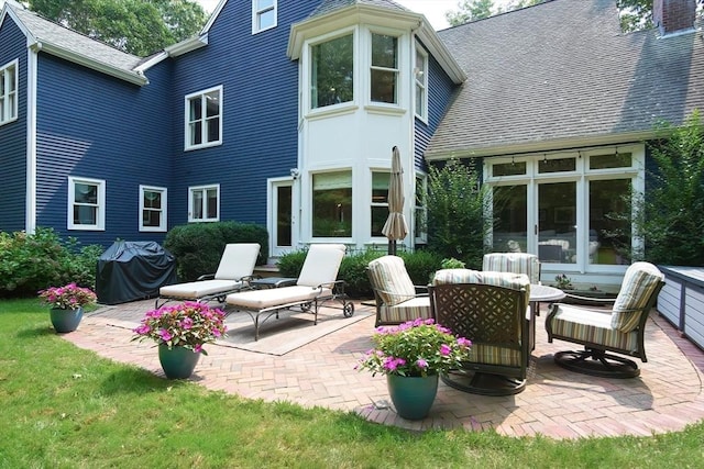 back of house with a patio area