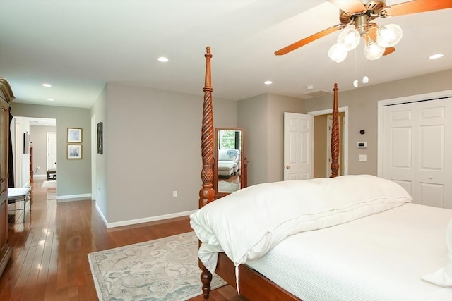 bedroom with baseboards, a closet, wood finished floors, and recessed lighting