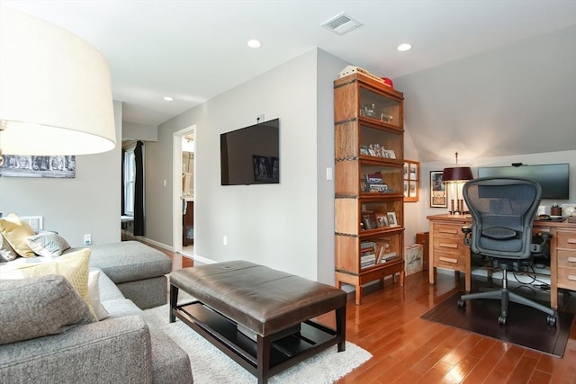 living room featuring visible vents, wood finished floors, and recessed lighting