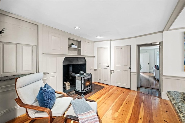 2 Andover St Unit A, Salem, MA 01970 - living area with a wood stove, light wood-type flooring, and recessed lighting