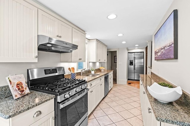 2 Andover St Unit A, Salem, MA 01970 - kitchen featuring appliances with stainless steel finishes, under cabinet range hood, light tile patterned flooring, recessed lighting, and white cabinets