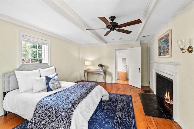 2 Andover St Unit A, Salem, MA 01970 - bedroom with a fireplace with flush hearth, hardwood / wood-style floors, ornamental molding, and a ceiling fan
