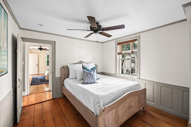 2 Andover St Unit A, Salem, MA 01970 - bedroom featuring hardwood / wood-style floors, crown molding, a wainscoted wall, and ceiling fan
