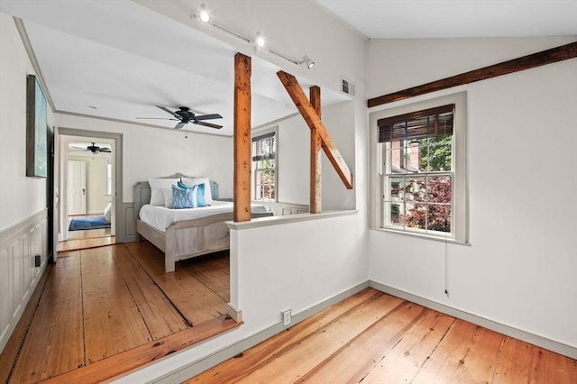 2 Andover St Unit A, Salem, MA 01970 - bedroom featuring multiple windows, vaulted ceiling, wood-type flooring, and a ceiling fan