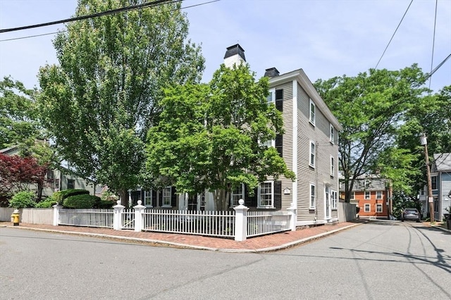 2 Andover St Unit A, Salem, MA 01970 - view of front facade with a chimney and a fenced front yard