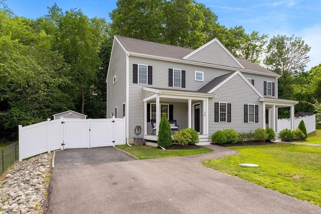 30 Oak Meadow Pl Unit 30, Bridgewater, MA 02324 - view of front of home featuring a gate, a porch, driveway, and a shingled roof