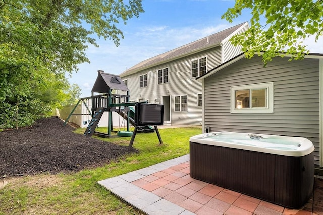 30 Oak Meadow Pl Unit 30, Bridgewater, MA 02324 - rear view of property with a hot tub, a playground, a patio area, and a lawn