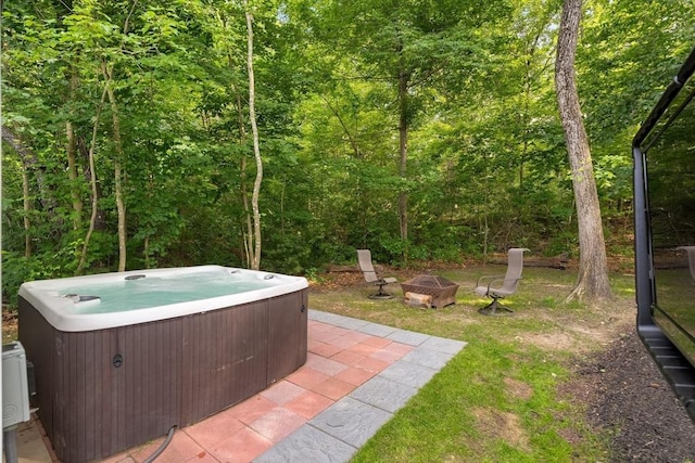 30 Oak Meadow Pl Unit 30, Bridgewater, MA 02324 - view of yard with a hot tub, a fire pit, a forest view, and a patio area