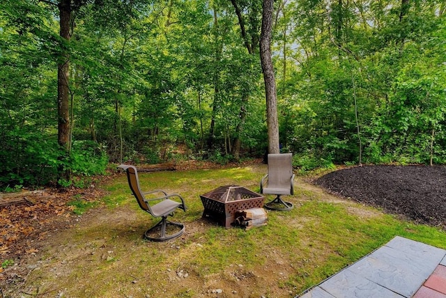 30 Oak Meadow Pl Unit 30, Bridgewater, MA 02324 - view of yard with an outdoor fire pit and a view of trees