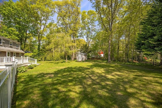 view of yard with a shed and an outdoor structure