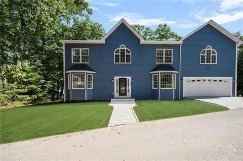 70 Shady Ln, Burrillville, RI 02859 - colonial-style house featuring a garage, a front yard, and driveway