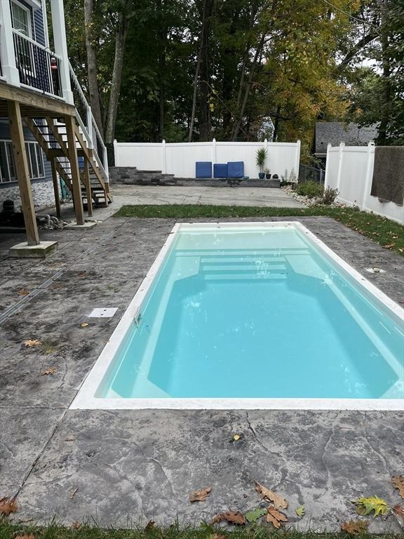 70 Shady Ln, Burrillville, RI 02859 - view of pool with a fenced backyard, a patio area, and stairs