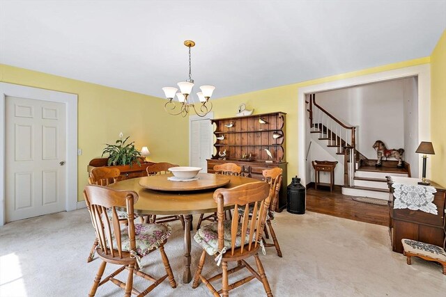 589 Depot St, Harwich, MA 02645 - dining space featuring a notable chandelier, stairs, and light carpet