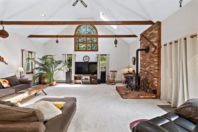 589 Depot St, Harwich, MA 02645 - carpeted living room featuring high vaulted ceiling and a wood stove