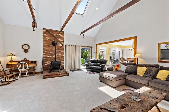 589 Depot St, Harwich, MA 02645 - living room featuring carpet floors, high vaulted ceiling, a wood stove, and beamed ceiling