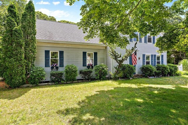 589 Depot St, Harwich, MA 02645 - view of front of house with a front lawn and a shingled roof