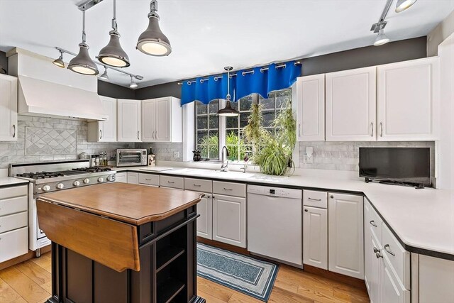 589 Depot St, Harwich, MA 02645 - kitchen with white cabinetry, light wood-type flooring, dishwasher, and gas stove