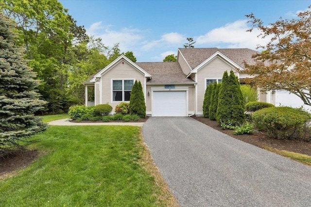 17 Chadwick Ct Unit 17, Mashpee, MA 02649 - view of front of home featuring an attached garage, driveway, a front lawn, and a shingled roof
