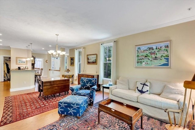 17 Chadwick Ct Unit 17, Mashpee, MA 02649 - living area with a chandelier, wood finished floors, crown molding, and recessed lighting