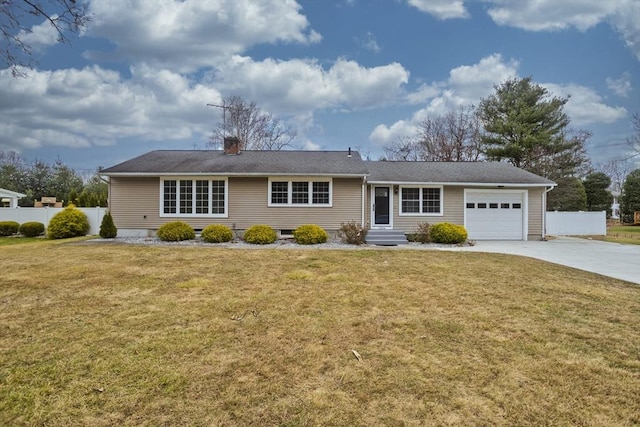 ranch-style house with entry steps, an attached garage, fence, concrete driveway, and a front yard