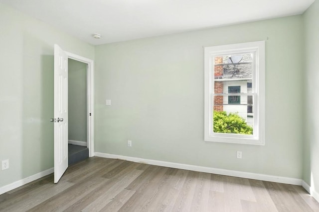 80-82 Kenyon St, Springfield, MA 01109 - unfurnished room with wood finished floors, baseboards, and a smoke detector
