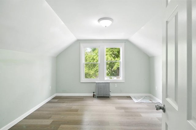 80-82 Kenyon St, Springfield, MA 01109 - bonus room featuring radiator, wood finished floors, vaulted ceiling, and baseboards