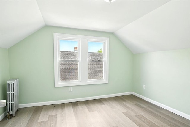 80-82 Kenyon St, Springfield, MA 01109 - additional living space featuring radiator heating unit, light wood finished floors, lofted ceiling, and baseboards