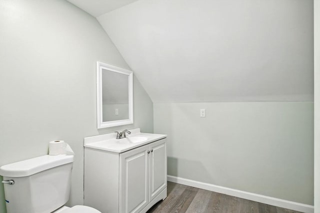 80-82 Kenyon St, Springfield, MA 01109 - bathroom featuring vaulted ceiling, vanity, toilet, wood finished floors, and baseboards