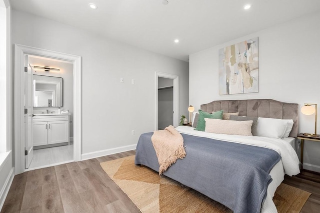 523 2nd St Unit 303, Everett, MA 02149 - bedroom with light wood-style floors, recessed lighting, ensuite bath, and baseboards