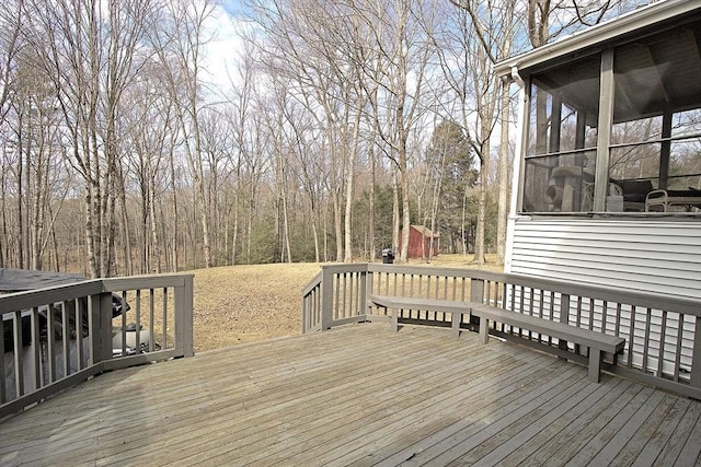 wooden deck with a sunroom