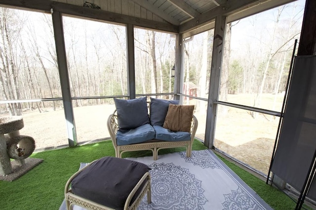 sunroom with lofted ceiling and wooden ceiling