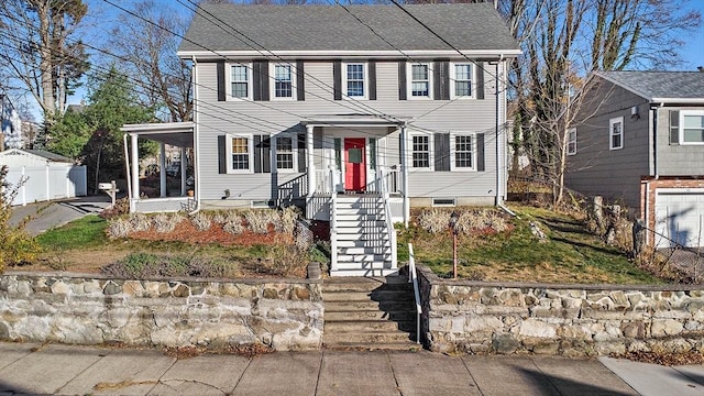 colonial inspired home featuring a porch