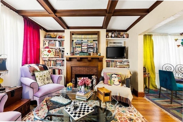 2218 Mystic Valley Pkwy, Medford, MA 02155 - sitting room with coffered ceiling, wood finished floors, beamed ceiling, and a brick fireplace