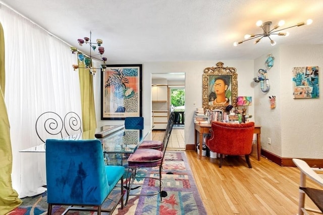 2218 Mystic Valley Pkwy, Medford, MA 02155 - dining area with wood finished floors and a chandelier