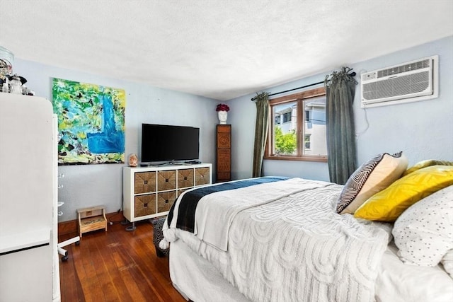 2218 Mystic Valley Pkwy, Medford, MA 02155 - bedroom featuring an AC wall unit and hardwood / wood-style flooring